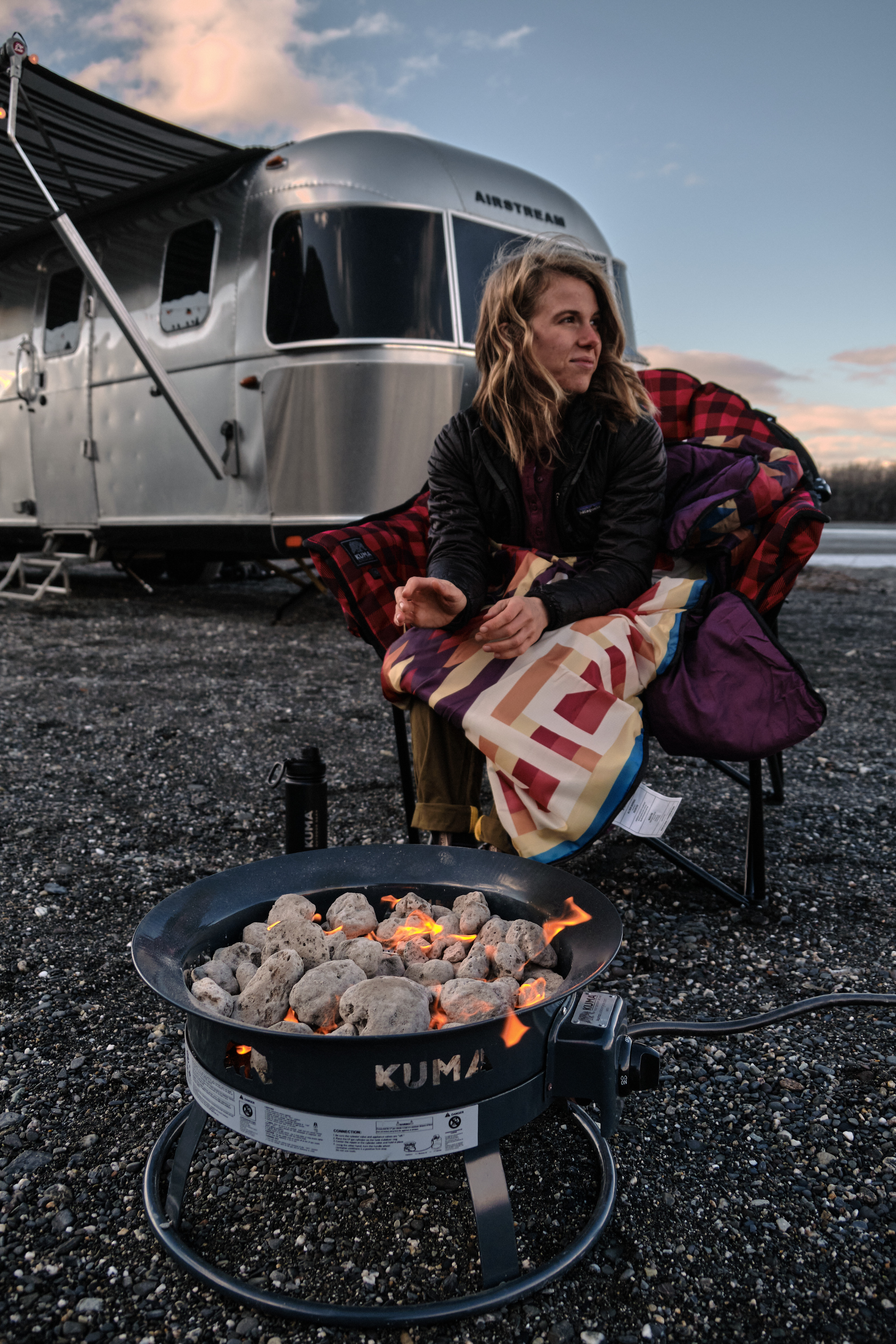 woman relaxing in a KUMA heated outdoor chair