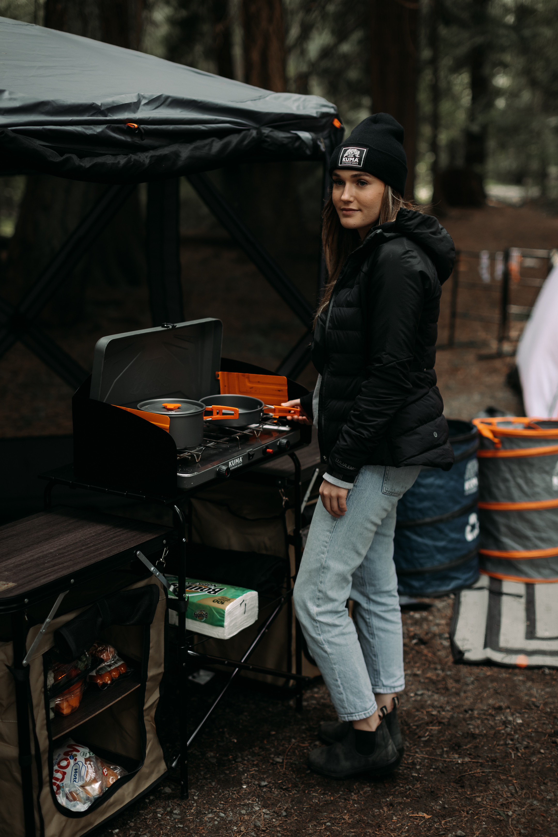 Woman on camping kitchen